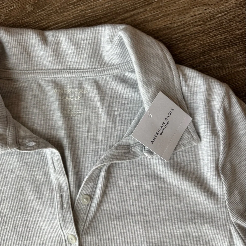 NWT Light Gray Ribbed Button Up Bodysuit - Picture 2 of 4
